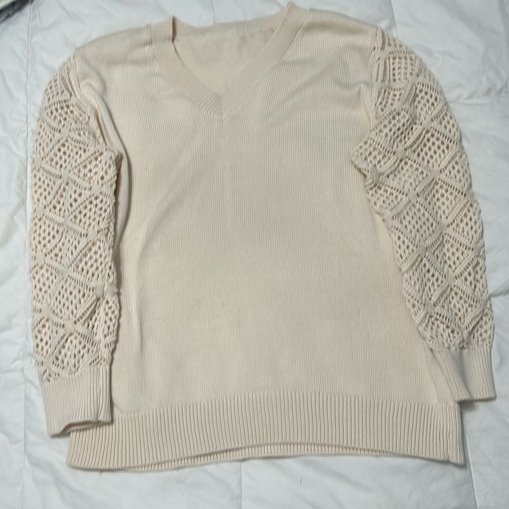 Cream colored 
V neck sweater
Large
New without tags